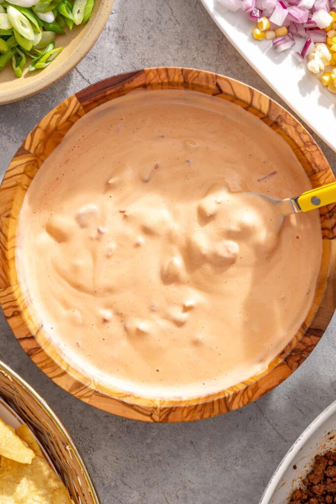 Rotel tomatoes added to creamy cottage cheese queso for nachos