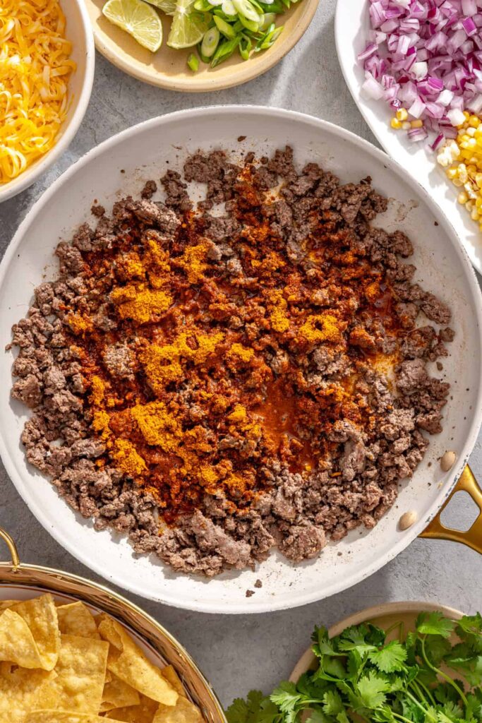 Ground beef cooking in a skillet for air fryer nachos