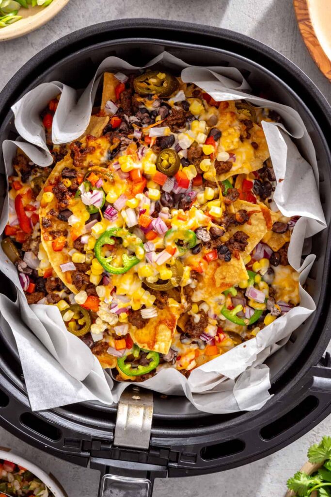 Melted cheese and golden tortilla chips on air fryer beef nachos