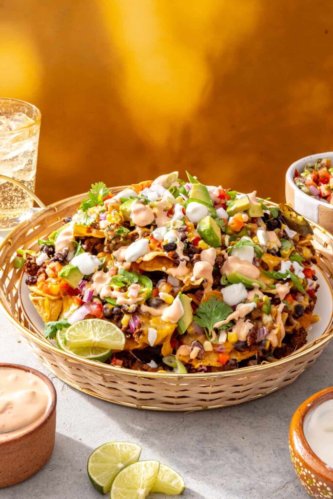 Air fryer beef nachos served in a basket with high-protein cottage cheese queso