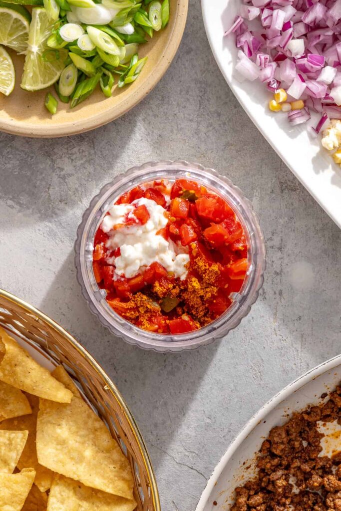 Cottage cheese, taco seasoning, and Rotel in a blender for high-protein queso