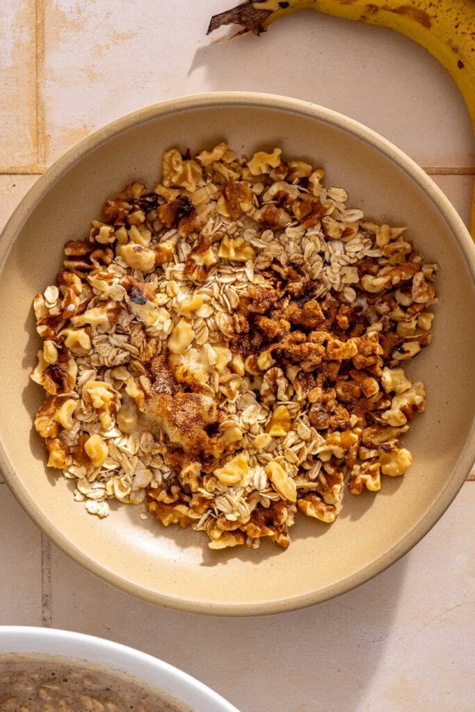 Preparing the salted maple walnut crumble for banana bread baked oatmeal