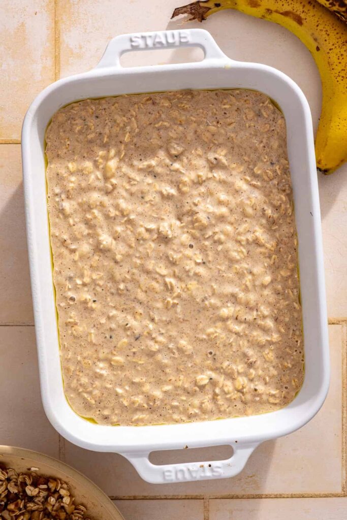 Banana bread baked oatmeal mixture resting while the oats absorb the liquid