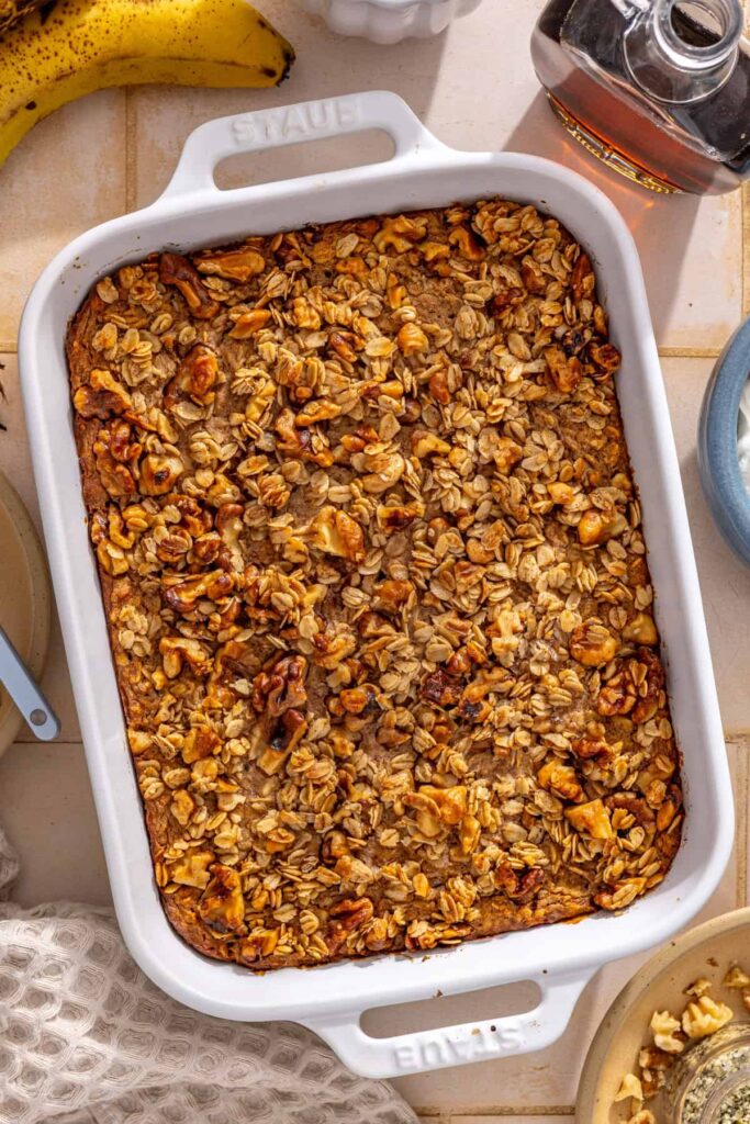 Banana baked oatmeal baked until golden and set with a crisp walnut crumble