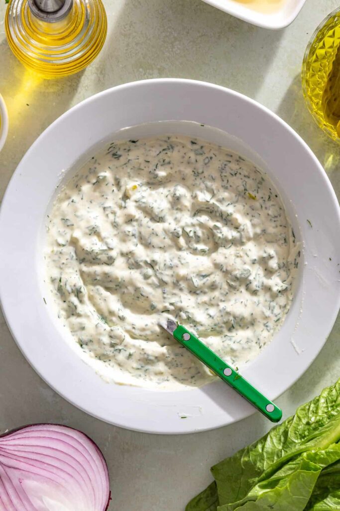 Creamy Greek yogurt pickle ranch with fresh dill and diced pickles