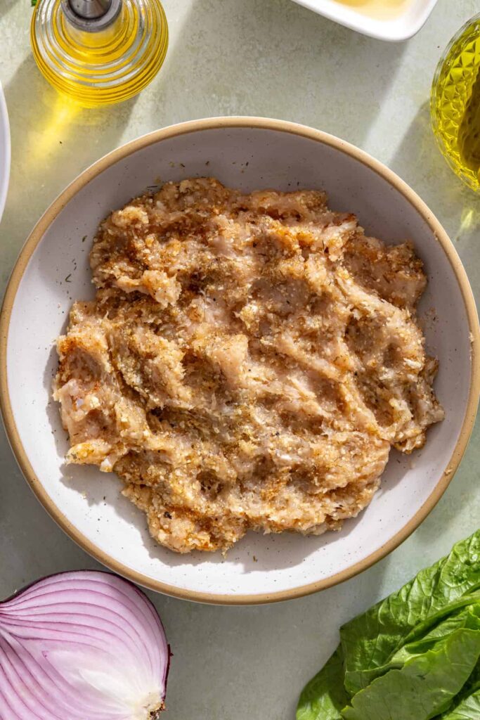 Ground chicken mixed with pickle juice, dill, garlic, onion, and seasonings