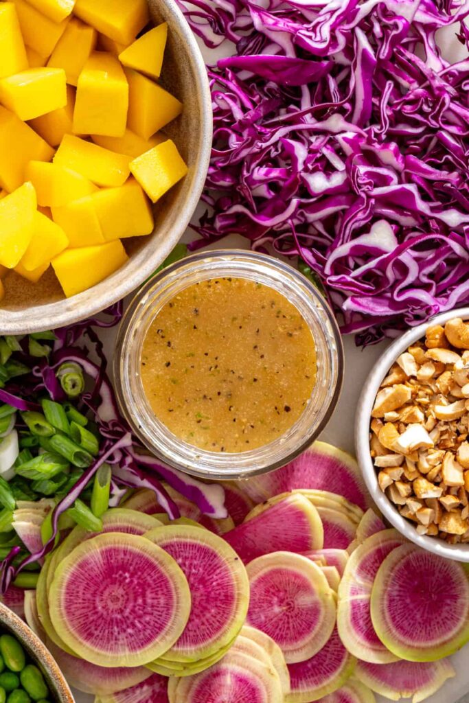 Homemade sesame lime dressing for cucumber mango steak salad