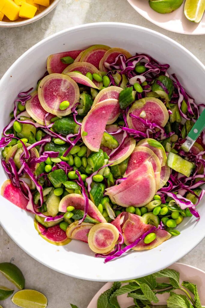 Smashed cucumber salad tossed with sesame lime dressing