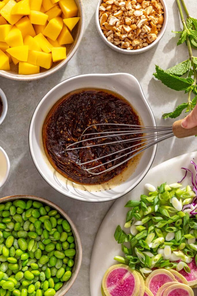 Whisking ginger sesame marinade for flank steak