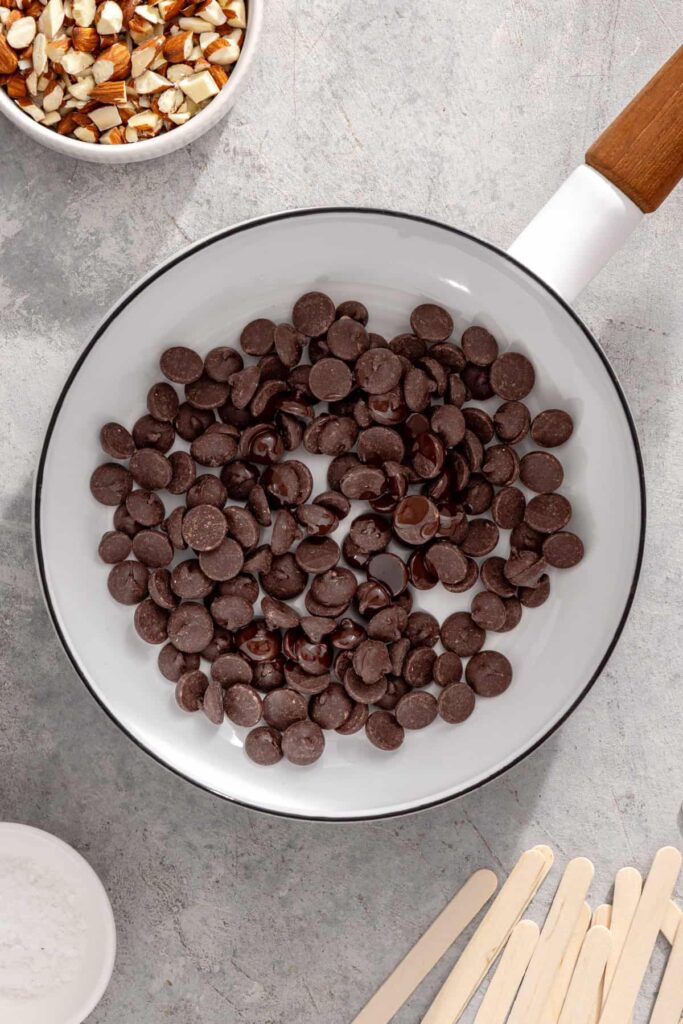 Chocolate chips and coconut oil melting together to make the chocolate shell for Magnum-style ice cream bars