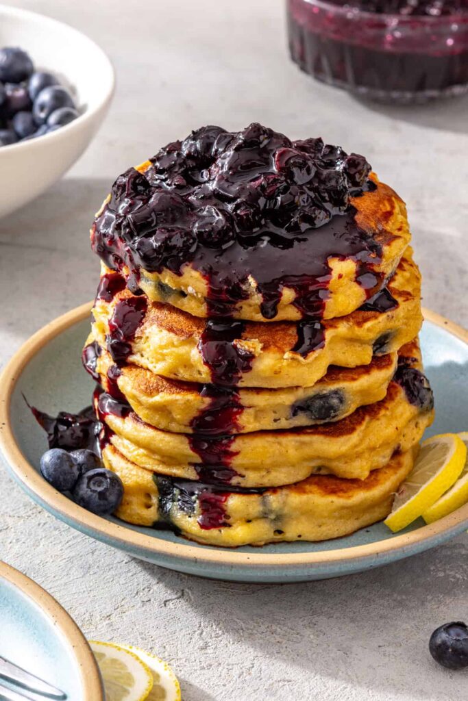 Fluffy high-protein cottage cheese pancakes topped with homemade blueberry honey compote
