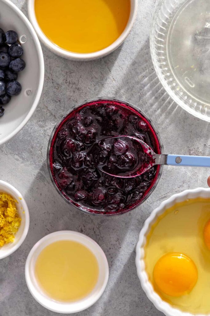 Glossy blueberry honey compote ready to serve with pancakes
