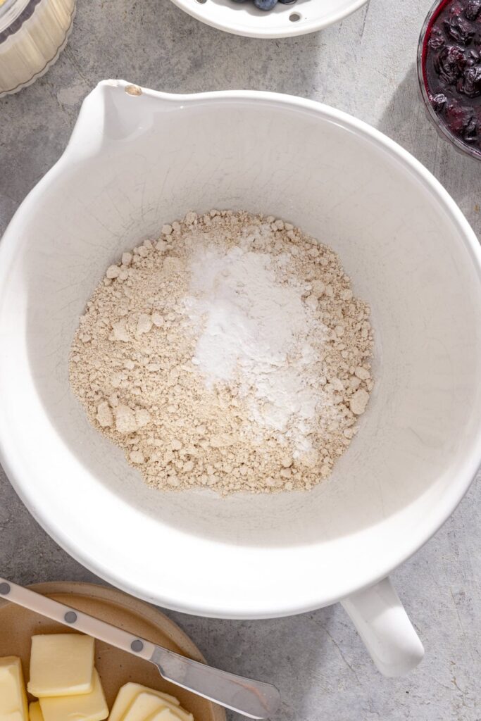Oat flour, baking powder, baking soda and salt whisked together for pancakes