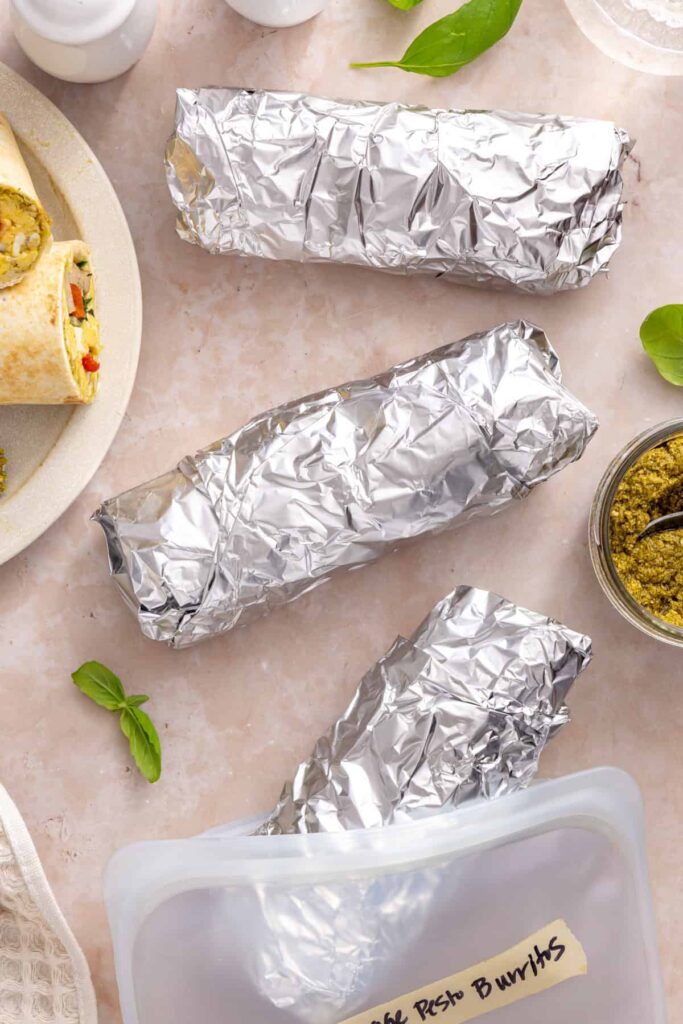Chicken breakfast burritos individually wrapped in foil for meal prep