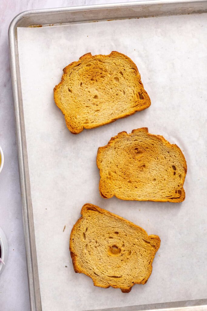Golden, crisp sourdough bread prepared for making toasted breadcrumbs for chicken cutlets.