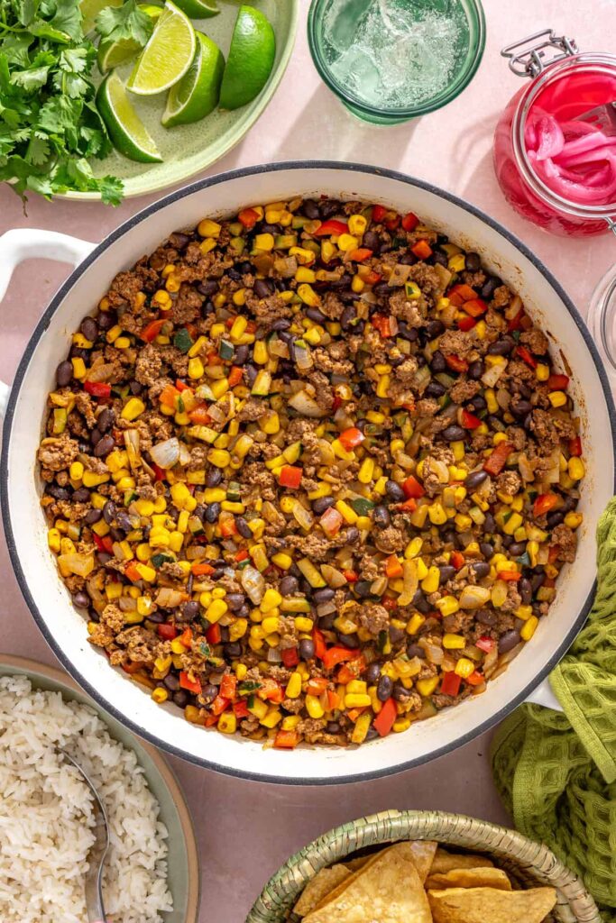 overhead photo of the finished street corn taco skillet without garnishes, cooling on a styled table