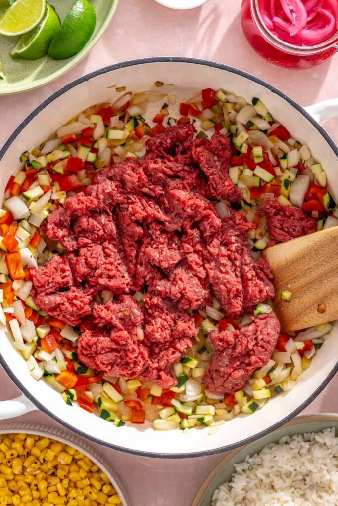 Ground beef added to sautéed vegetables for street corn taco skillet