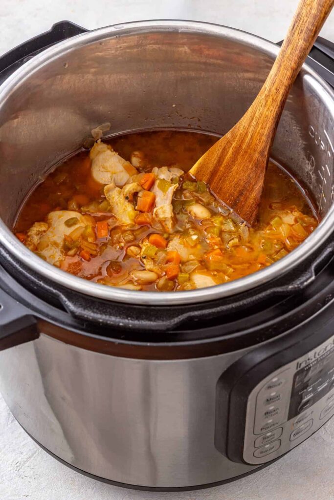 Cooked chicken thighs in the Instant Pot after pressure cooking for buffalo chicken chili
