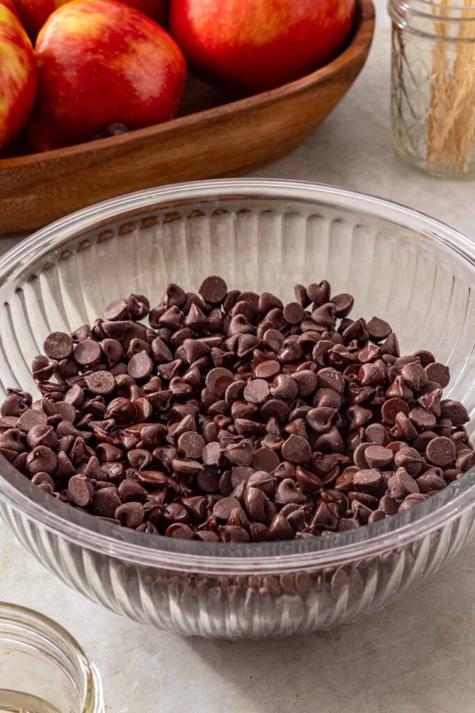 bowl of dark chocolate tips, ready to be melted for date caramel apple