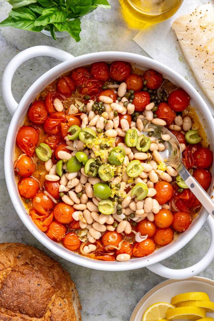White beans, Castelvetrano olives, capers, and lemon zest stirred into the roasted tomato mixture.