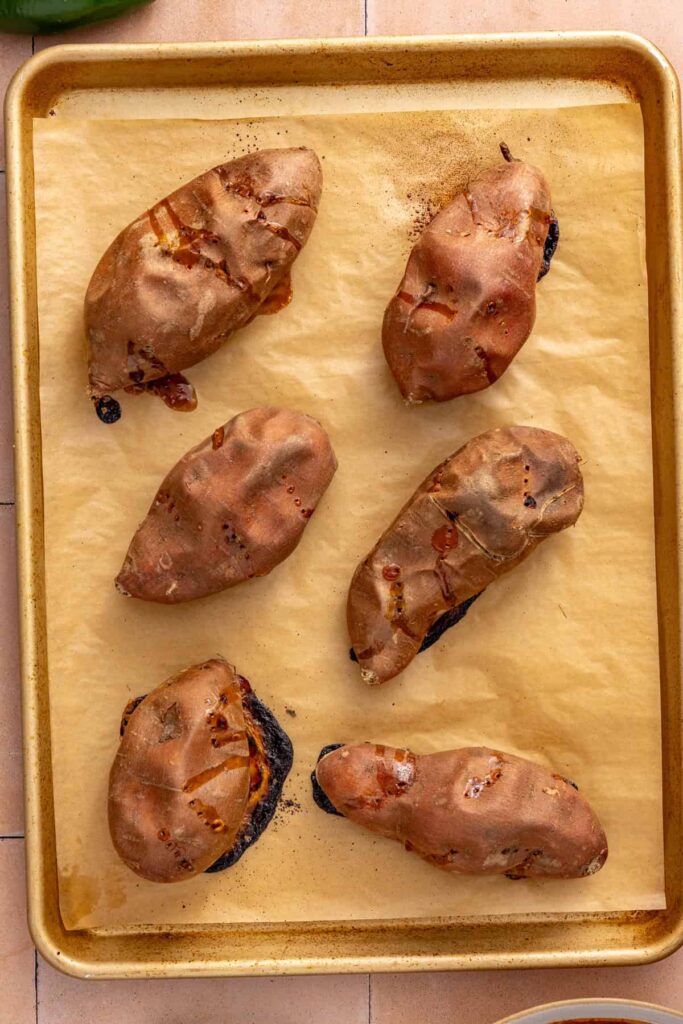 Oven-baked sweet potatoes roasted until tender to use as the base for shredded beef taco filling.